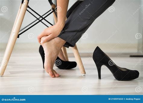 Businesswoman Rubbing Her Feet Stock Image Image Of Desk Ache 210591653