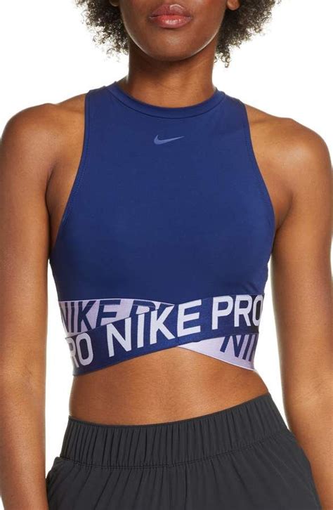 A Woman Wearing A Blue Sports Bra Top With Nike Print On The Front And