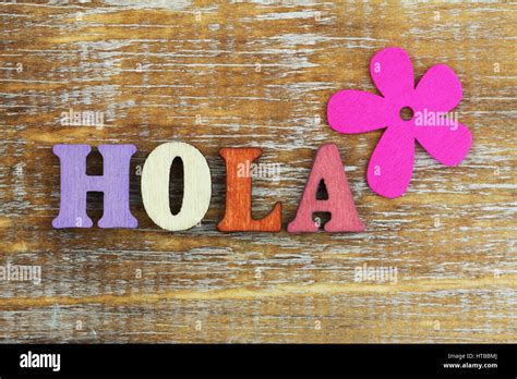 Hola Hello In Spanish Written With Colorful Wooden Letters And Pink