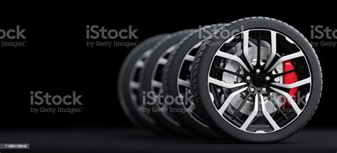 Set Of Wheels With Modern Alu Rims On Black Background Stock Photo