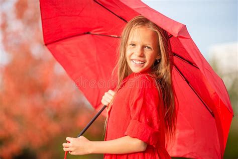 Happy Child Girl Laughs Under Red Umbrella Stock Image Image Of