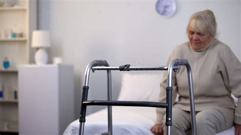 Hospital Walking Frame Front Of Injured Old Lady Sitting Bed Clinic