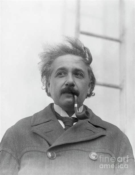 Albert Einstein Smoking A Pipe By Bettmann