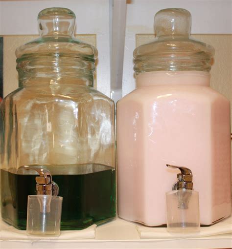 Laundry Soap Fabric Softener Stored Attractively In Clear Glass Lemonade Carafes Laundry Room