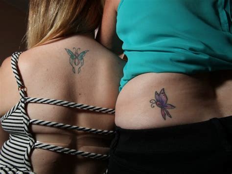 breast cancer survivors show strength with tattoos