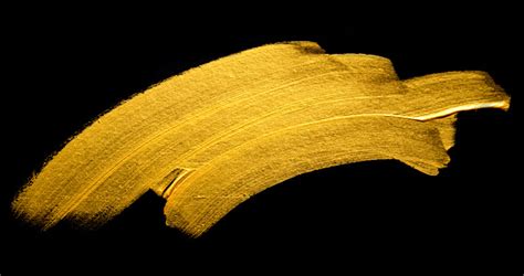 Gold Acrylic Paint Brush Stroke Hand Drawing Texture Isolated On Black