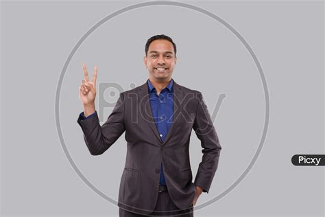 Image Of Businessman Showing Peace Sign Isolated Indian Business Man