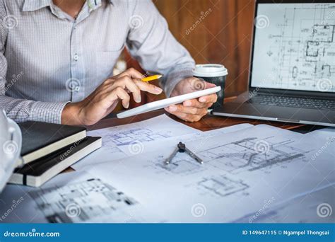 Construction Engineering Or Architect Hands Working On Blueprint