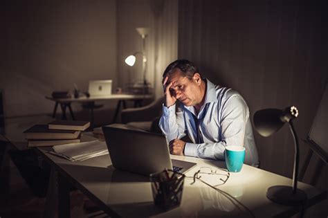 Senior Businessman Working Late Stock Photo Download Image Now Istock