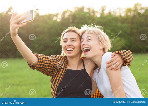 Two Woman Taking Selfies Outdoors Stock Image Image Of Selfies Posing 120718941