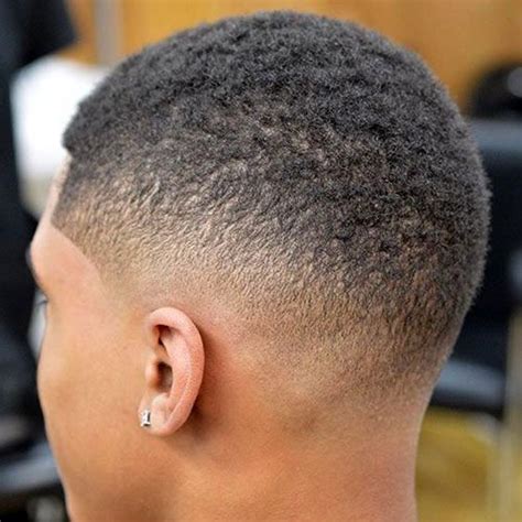 Fade haircut with slicked back blonde top. Pin on Black Men Haircuts