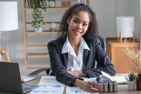 African American Businesswoman Working In The Office Using Laptops