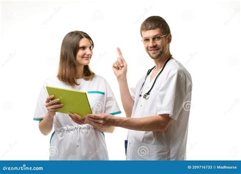 Two Doctors Discuss The Test Results One Of Them Happily Threw Up A Finger Stock Image Image