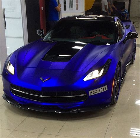 A Blue Sports Car Parked In A Garage