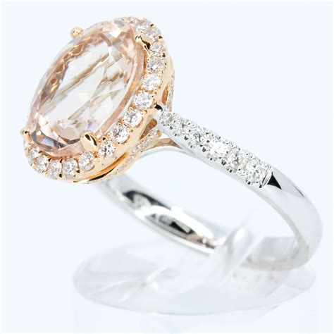 Oval Cut Morganite Ring With Halo Of Diamonds Set In 18ct White