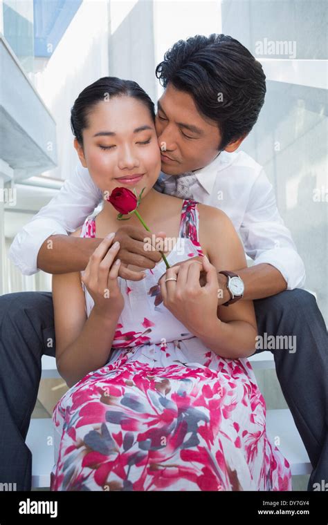 Man Offering A Red Rose To Girlfriend Stock Photo Alamy