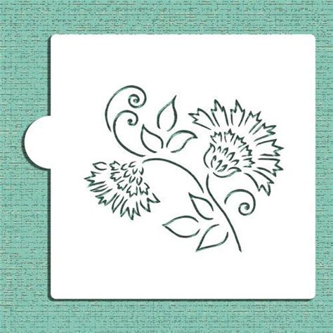 A Stencil With Flowers And Leaves On The Bottom In White Paper Against