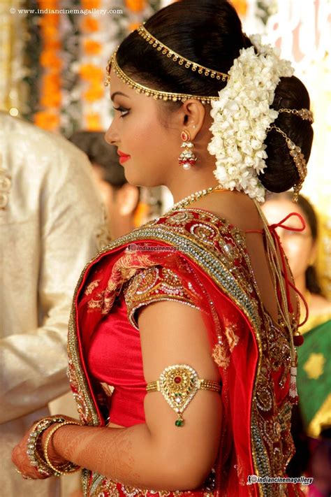 Hairstyles for traditional sarees, hairstyles with silk sarees, indian bridal hairstyles, party wear hairstyles for sarees, indian hairstyles, actress. Traditional Southern Indian bride wearing bridal silk ...