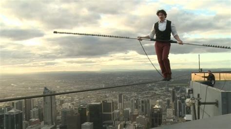 tightrope walker crosses melbourne skyline bbc news