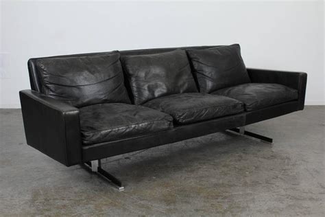 Stay close to the ground but have enough clearance for easy sweeping with these cylinder legs. Mid-Century Modern Black Leather Sofa with Chrome Legs at ...