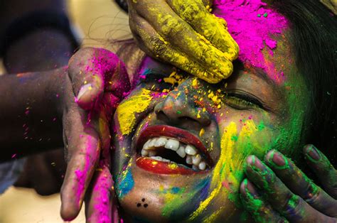 During holi, hindus attend a public bonfire, spray friends and family with colored powders and water, and generally go a bit wild in the streets. India erupts in colors as Hindus celebrate Holi - Los Angeles Times
