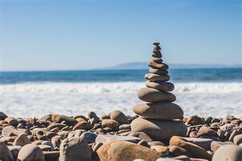 Stone Balancing With Pebble Tower On The Ventura Rocky Beach Pebble