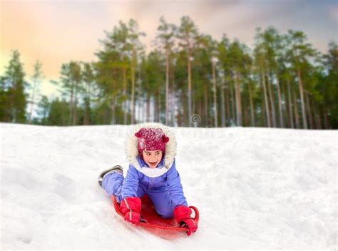 Girl Sliding Down On Snow Saucer Sled In Winter Stock Image Image Of