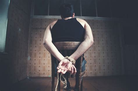 Premium Photo Young Man Tied To Chair