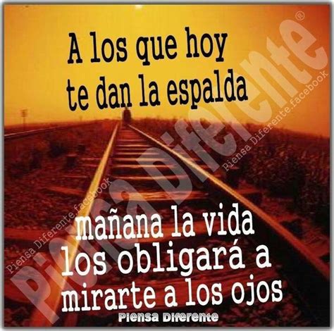 A Train Track With An Orange Sky In The Background And Spanish Words