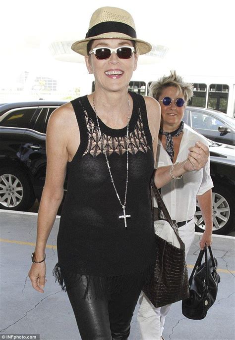 Sharon Stone Goes Braless And Suffers Wardrobe Malfunction At LAX Go