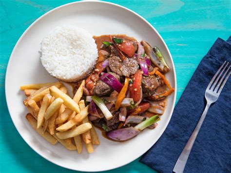 Lomo Saltado Peruvian Stir Fried Beef With Onion Tomatoes And French