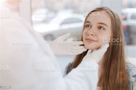 Skilled Dermatologist Examining Patient Skin In The Clinic Stock Photo Download Image Now Istock