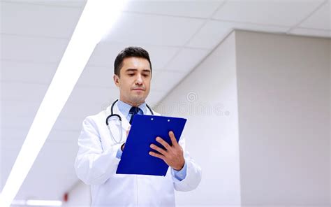 Doctor With Clipboard At Hospital Corridor Stock Image Image Of