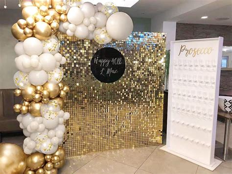 A Gold And White Balloon Arch In An Office