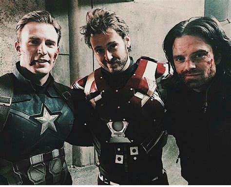 chris evans and sebastian stan with robert downey jr s stunt double on the set of captain
