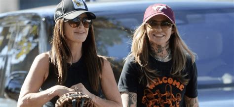 kyle richards and morgan wade spotted on intimate date in matching outfits leaning on each