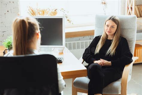 Young Woman Sitting In Office During The Job Interview With Female