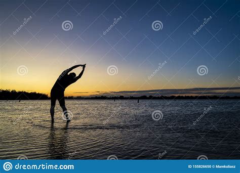 Sunrise Silhouette Of A Man On A Lake Stock Photo - Image of elderly ...