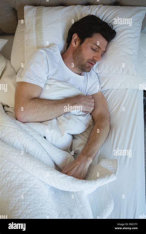Man Sleeping In Bedroom Stock Photo Alamy