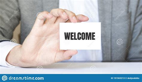 Businessman Holding A Card With Text Welcome Stock Image Image Of
