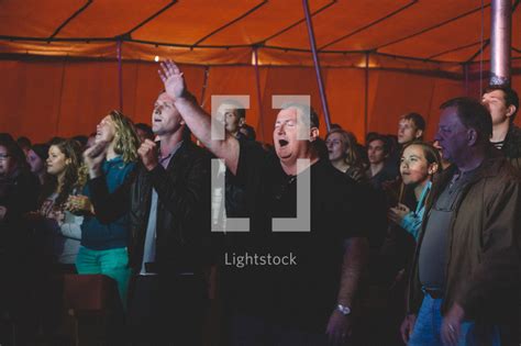 Congregation Standing With Hands Raised — Photo — Lightstock