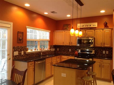 15 energizing orange paint and decor ideas. Burnt orange kitchen with new lighting! | Orange kitchen ...