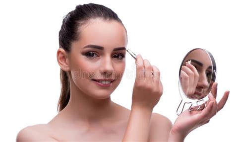 Woman In Beauty Concept Applying Make Up Using Cosmetics Stock Photo