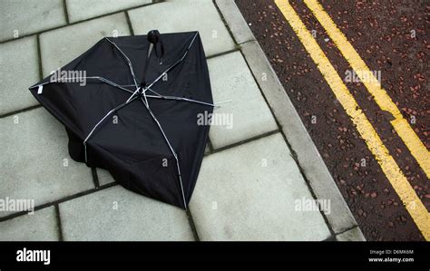 Broken Umbrella In Street Stock Photo Alamy