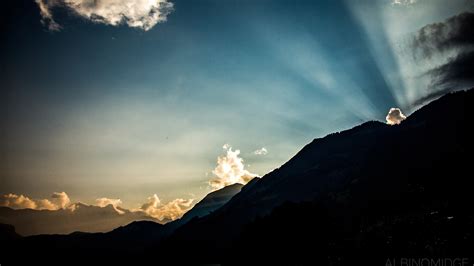 Sunrays Breaking Over The Mountains Of Switzerland