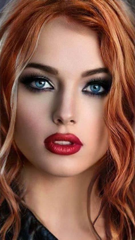 A Woman With Red Hair And Blue Eyes Is Wearing Black Eyeliners