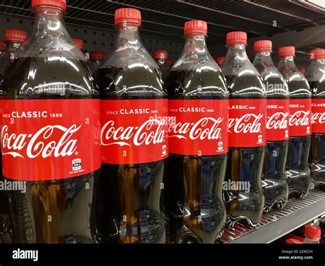 Coca Cola On A Shelf In The Supermarket Stock Photo Alamy