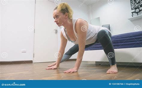 Woman Stretching Near Mirror At Her Apartment The Concept Of A Healthy