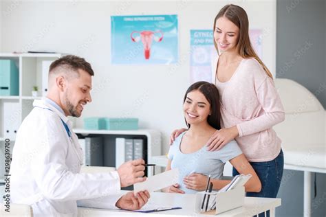 Lesbian Couple Visiting Male Gynecologist In Clinic Stock Photo Adobe