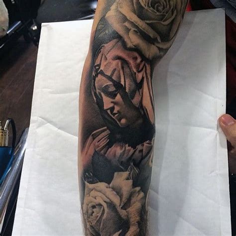 Tiny, single birds fly out from the elbow and up the shoulder in this tattoo for men. 75 Religious Sleeve Tattoos For Men - Divine Spirit Designs